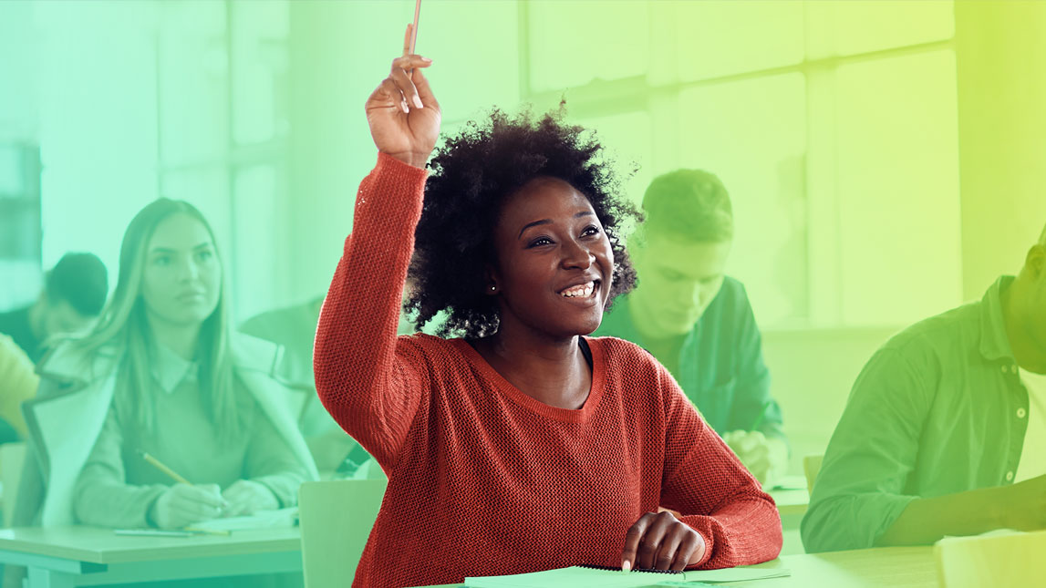 Photo of a high school student raising her hand in class